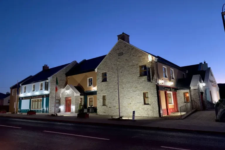 Charming Irish pub at dusk, showcasing traditional stone architecture in vibrant surroundings. Perfect for nights out.